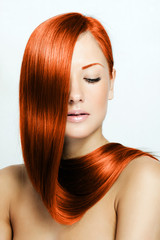 red hair , beautiful young red-headed woman with long shiny hair