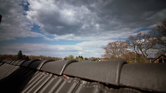 Roof with Clouds Timelapse 4K