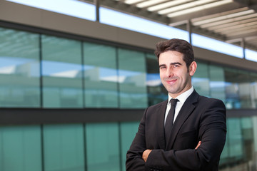 Fototapeta premium Portrait of a handsome young business man at modern office