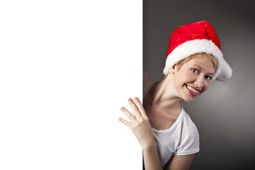 Beautiful christmas woman in santa hat