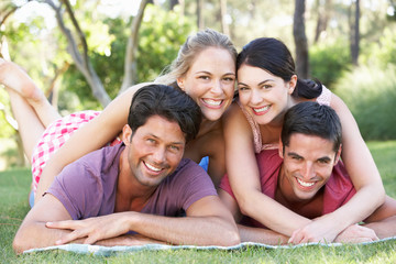 Group Of Friends Relaxing In Park Together