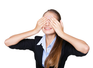 Cheerful young woman covering eyes with her hands isolated