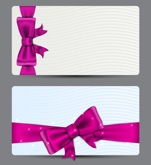 Gift cards with fuchsia bow.