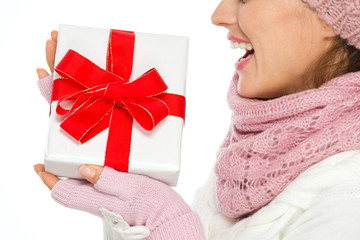 Closeup on Christmas present box in hand of woman