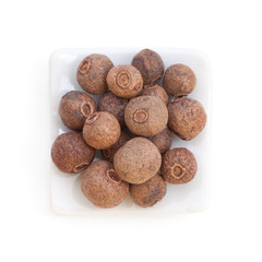 Pile Allspice (jamaica pepper)  in a white bowl on white backgro