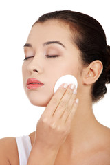 Beautiful woman with cotton pad