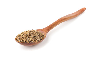 spice turmeric, coriander, cumin in wooden spoon isolated