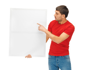 handsome man with big blank board