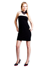 Young and beautiful woman in a black cocktail dress