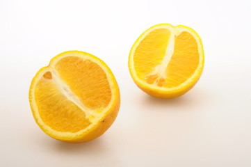 Half orange fruit on white background