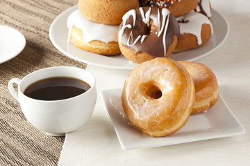 Fresh Homemade Donuts with Black Coffee
