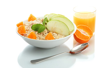 tasty oatmeal with orange and apple, isolated on white