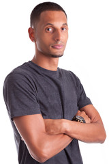 Portrait of a young african american man with folded arms
