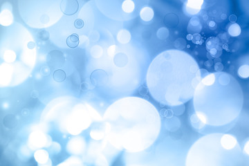 Abstract blue and white blurred circles background