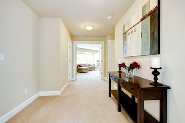 Large home hallway with art and furniture. - Powered by Adobe
