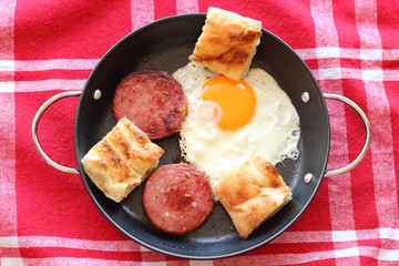 Gourmet breakfast sunny-side up egg and ham with turkish bread