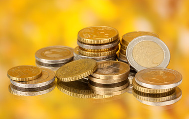 euro coins on color background