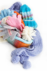 Winter accessory collection. Hat, scarf and mittens in the conta