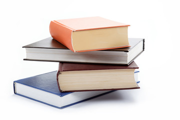 A stack of books on a white background.
