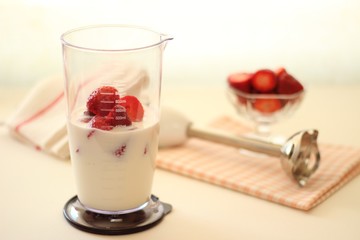 Strawberry and milk in multi blender