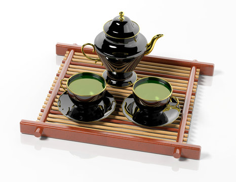 Black teapot and teacups on wooden tray