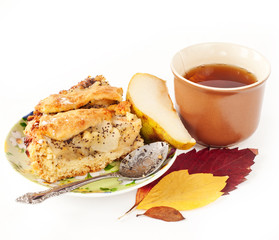 apple and pear pie with a cup of tea and autumn leaves