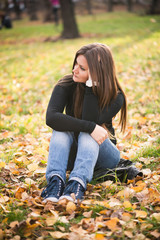 beautiful thoughtful girl  in autumn park
