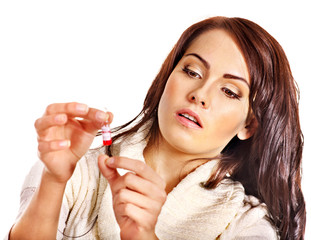 Obraz premium Young woman having flu takes pills.