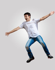 Young man dancing and jumping