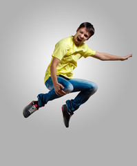 Young man dancing and jumping