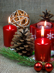 Red candles and pine