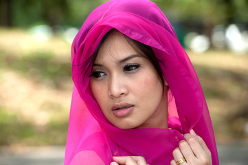 Pretty woman in Pink Indian clothes in posing .