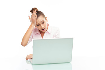 Upset woman looking at her laptop