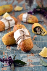 Fried rolls with fish and pesto sauce