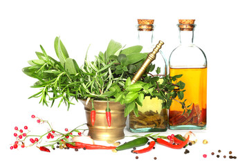 Mixed herbs of sage, rosemary, basil with red hot peper in morta
