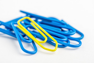 Yellow paperclip with lots of blue