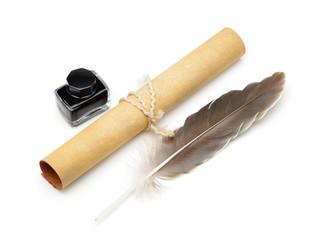 A feather pen, ink,rolls of old yellowed paper