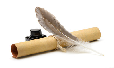 A feather pen, ink,rolls of old yellowed paper