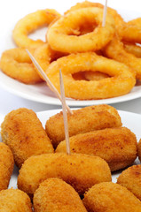 spanish croquettes and calamares a la romana, breaded and fried