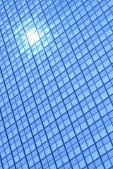 Modern building windows and sun reflection