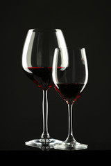 Fototapeta na wymiar Red Wine Glass silhouette Black Background