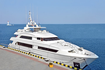 Fototapeta premium White motor yacht over harbor pier, Odessa, Ukraine