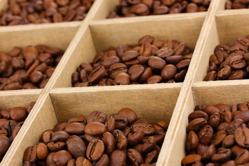Coffee beans in wooden box close-up