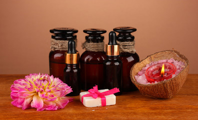 ingredients for soap making on brown background