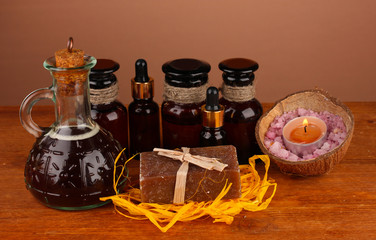 ingredients for soap making on brown background