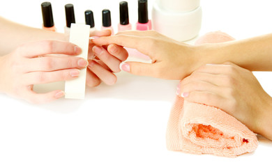 Manicure process in beauty salon, close up