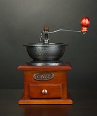 Coffee grinder on grey background