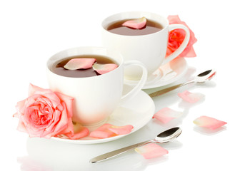 cups of tea with rose isolated on white