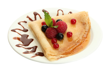 Delicious pancakes with berries,chocolate and honey
