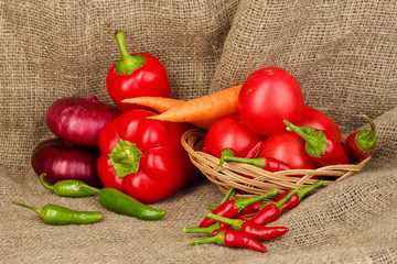 fresh red vegetables on sackcloth background